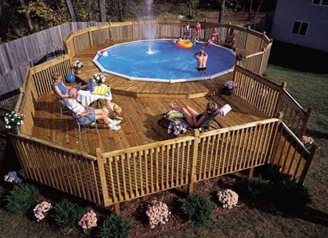 A wooden deck with a swimming pool.