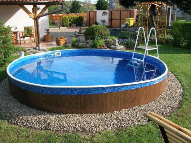 A swimming pool in a backyard.