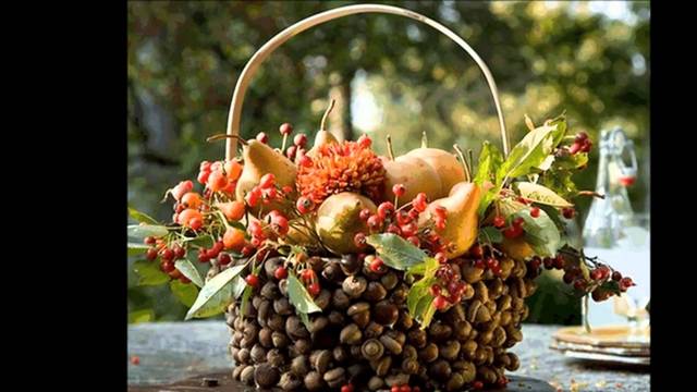 A basket filled with fruit and berries on a table.