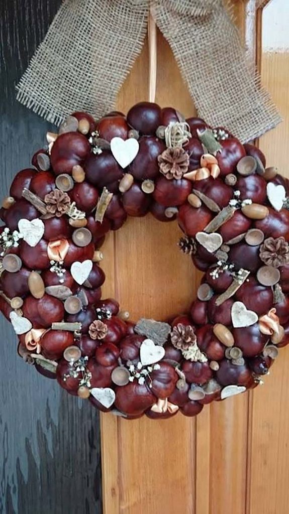 A wreath made out of chestnuts and acorns.