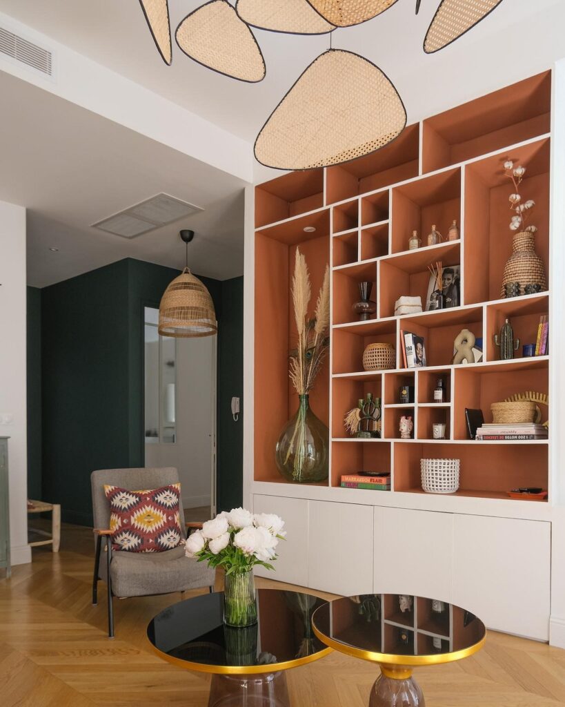 A living room with bookshelves and a coffee table.