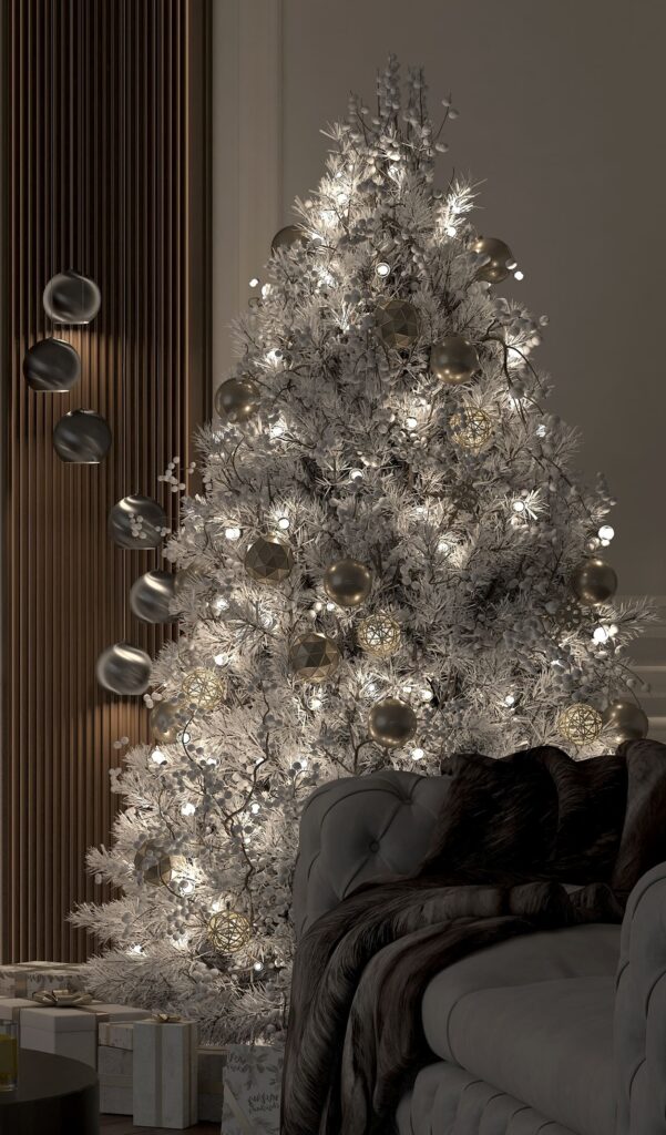 A white christmas tree in a living room.