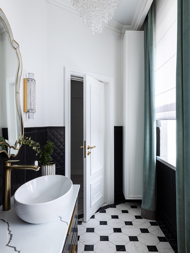 A bathroom with a black and white checkered floor.