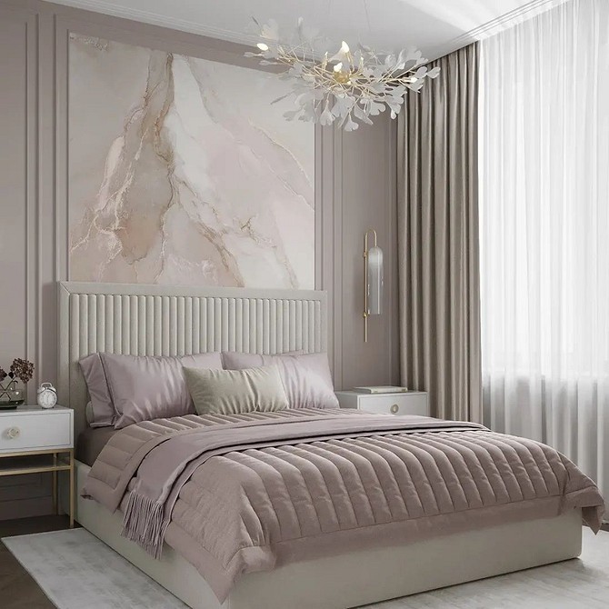 A bedroom with a white bed and a marble headboard.