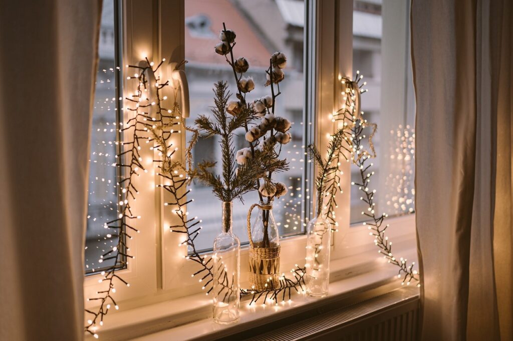 Christmas lights on a window sill.