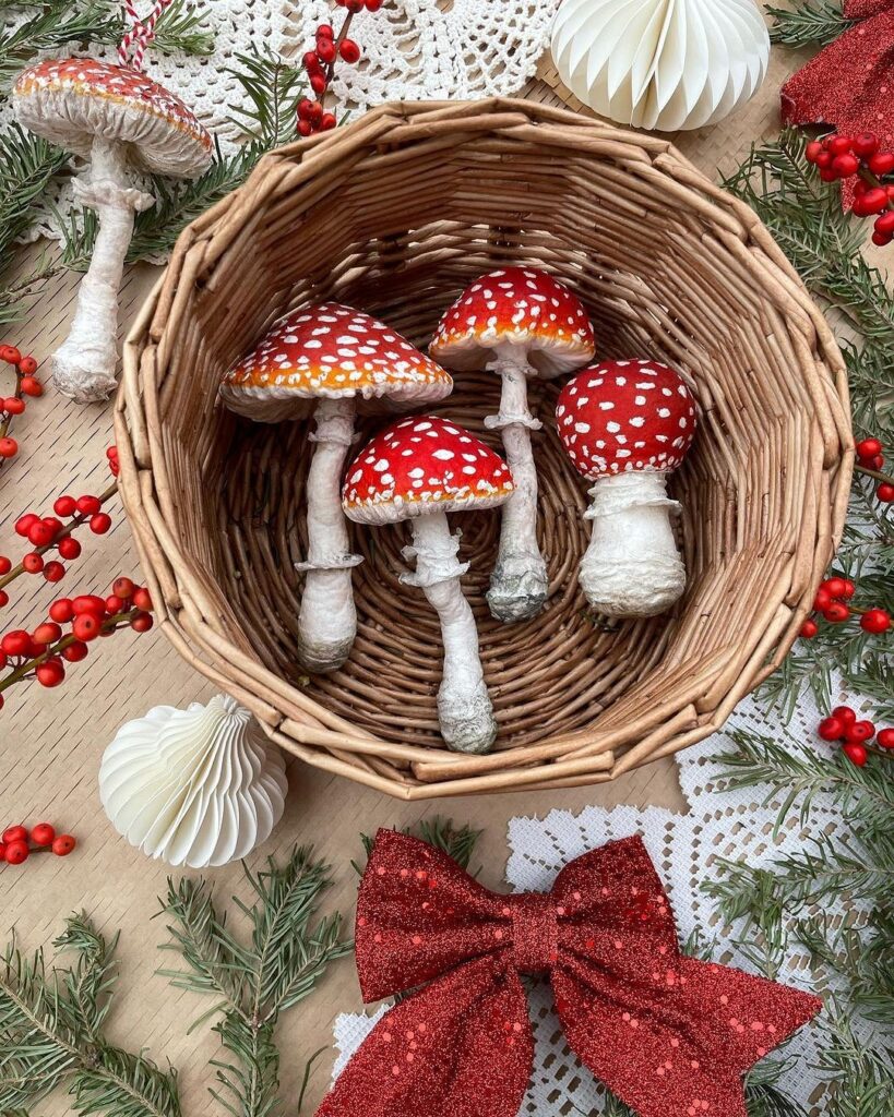 A wicker basket filled with red and white mushrooms.