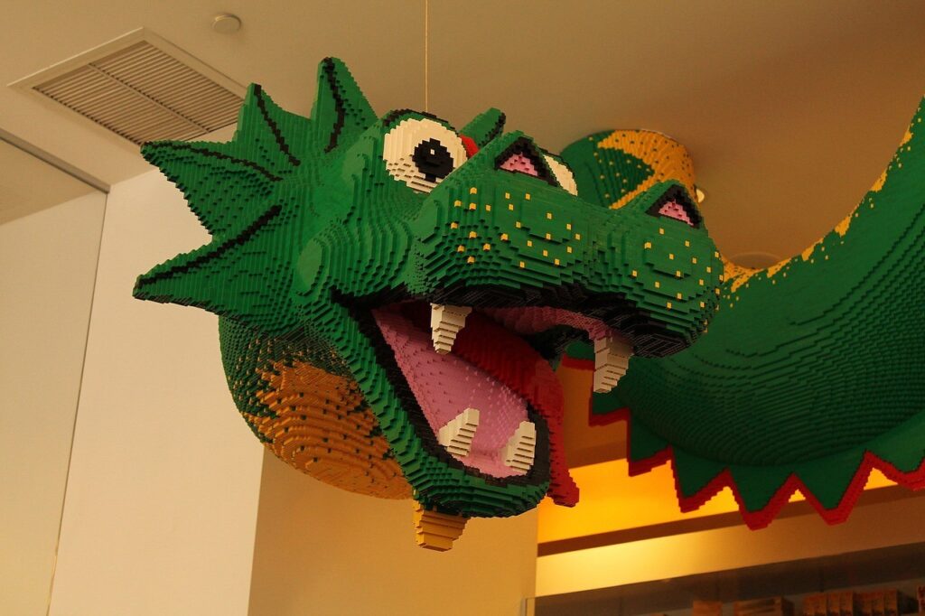 A lego dragon hanging from the ceiling.