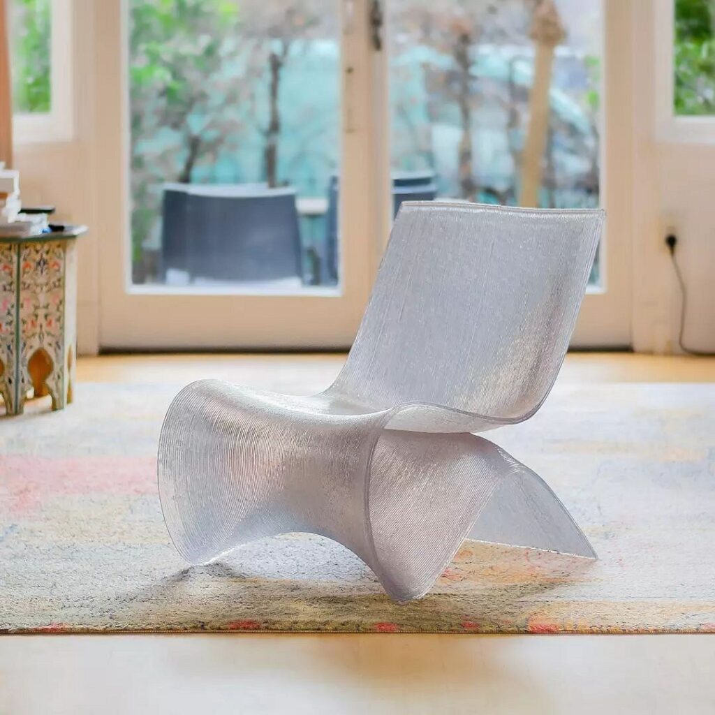 A white chair sitting on a rug in a living room.