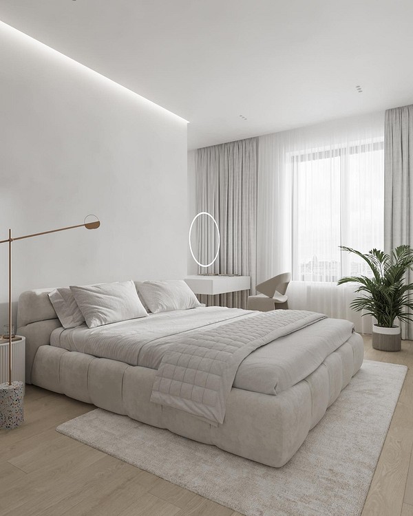 A modern bedroom with white walls and wooden floors.
