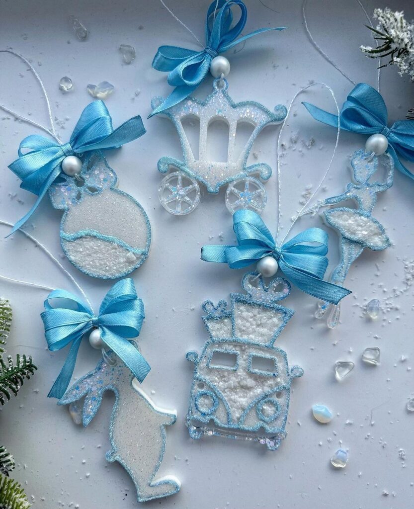 A set of blue and white ornaments with bows and ribbons.