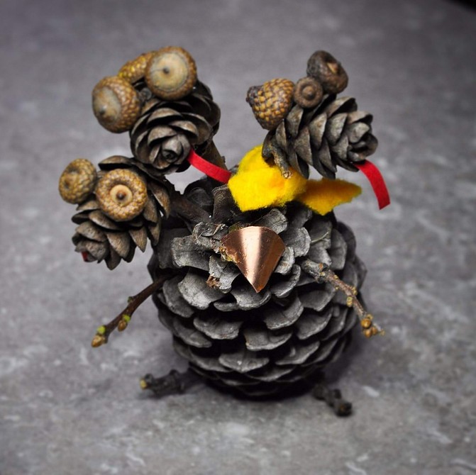 A turkey made out of pine cones.