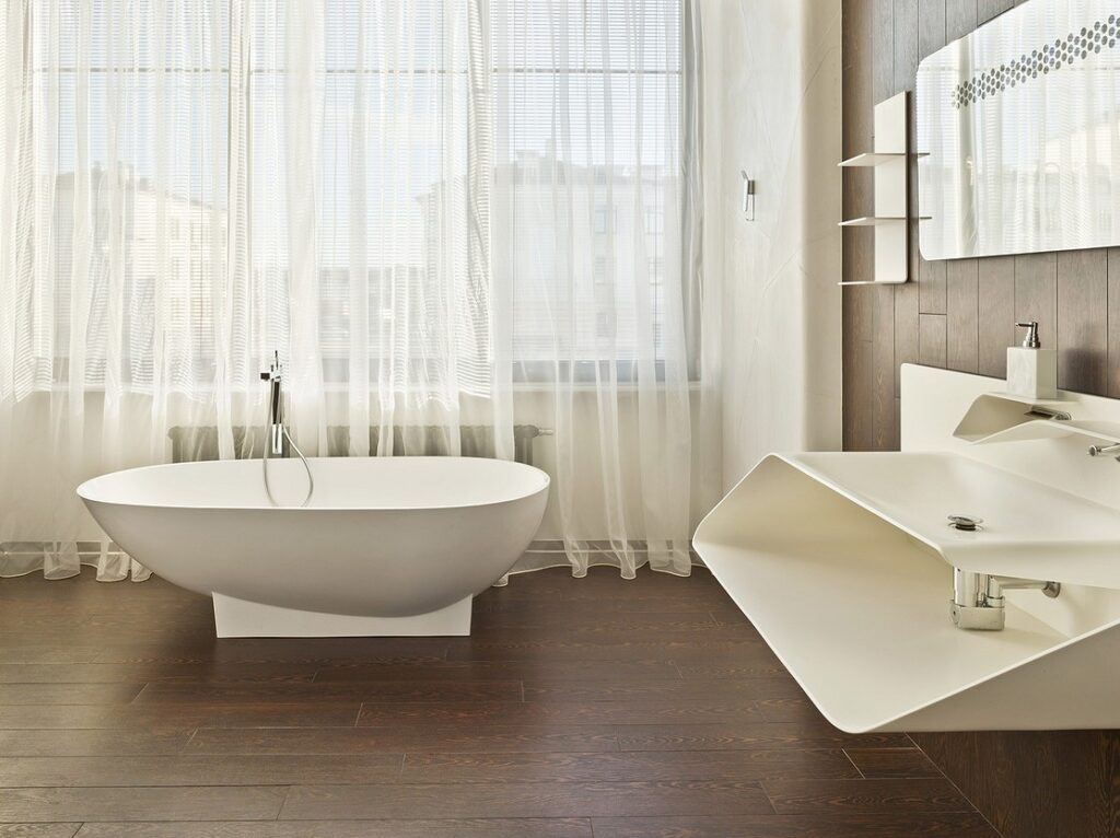 A white bathtub in a bathroom.