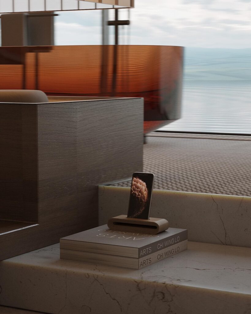 A phone is sitting on a table in a room with a view of the ocean.
