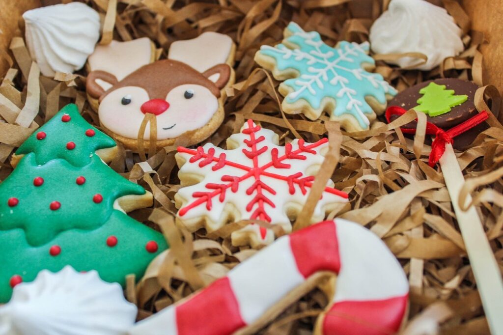 A box of decorated christmas cookies in a box.