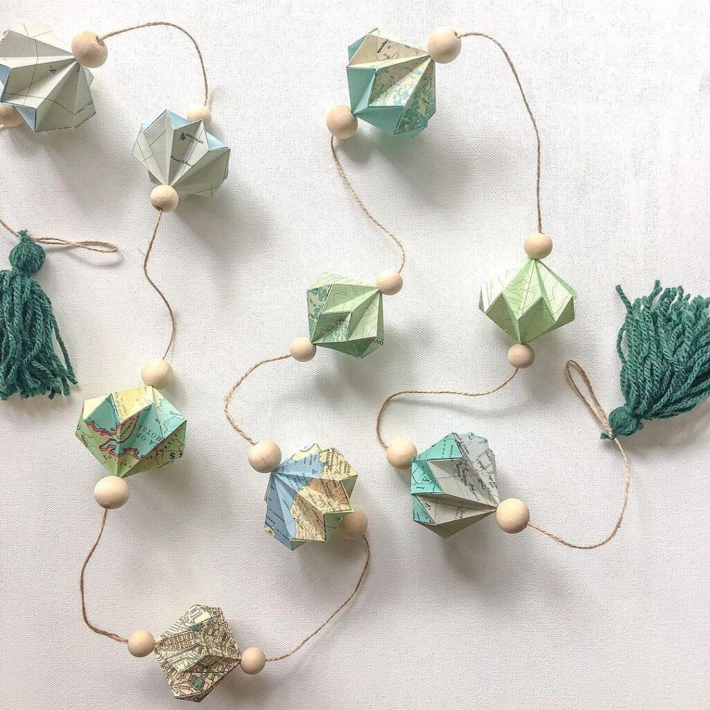 Origami paper garland with tassels.