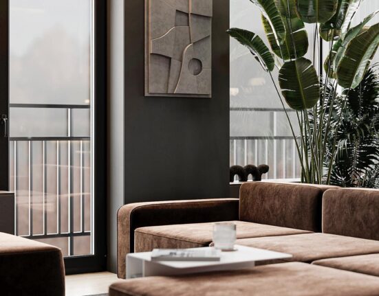 A living room with a brown couch and a coffee table.