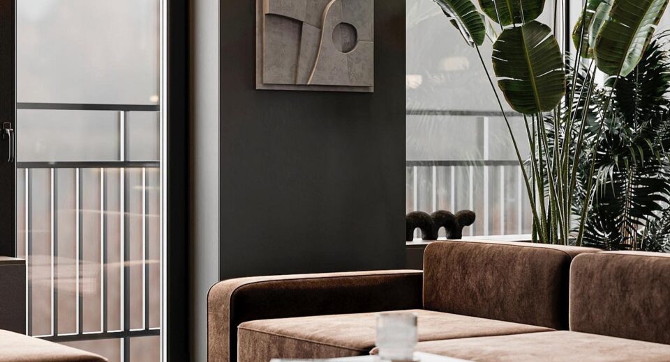 A living room with a brown couch and a coffee table.