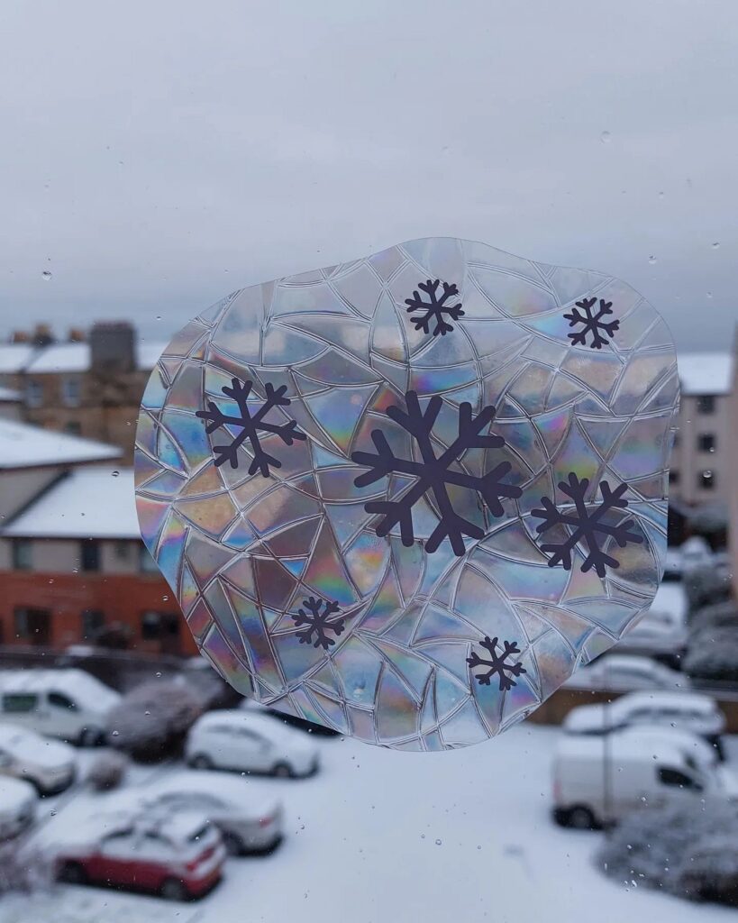 A window with snowflakes on it.