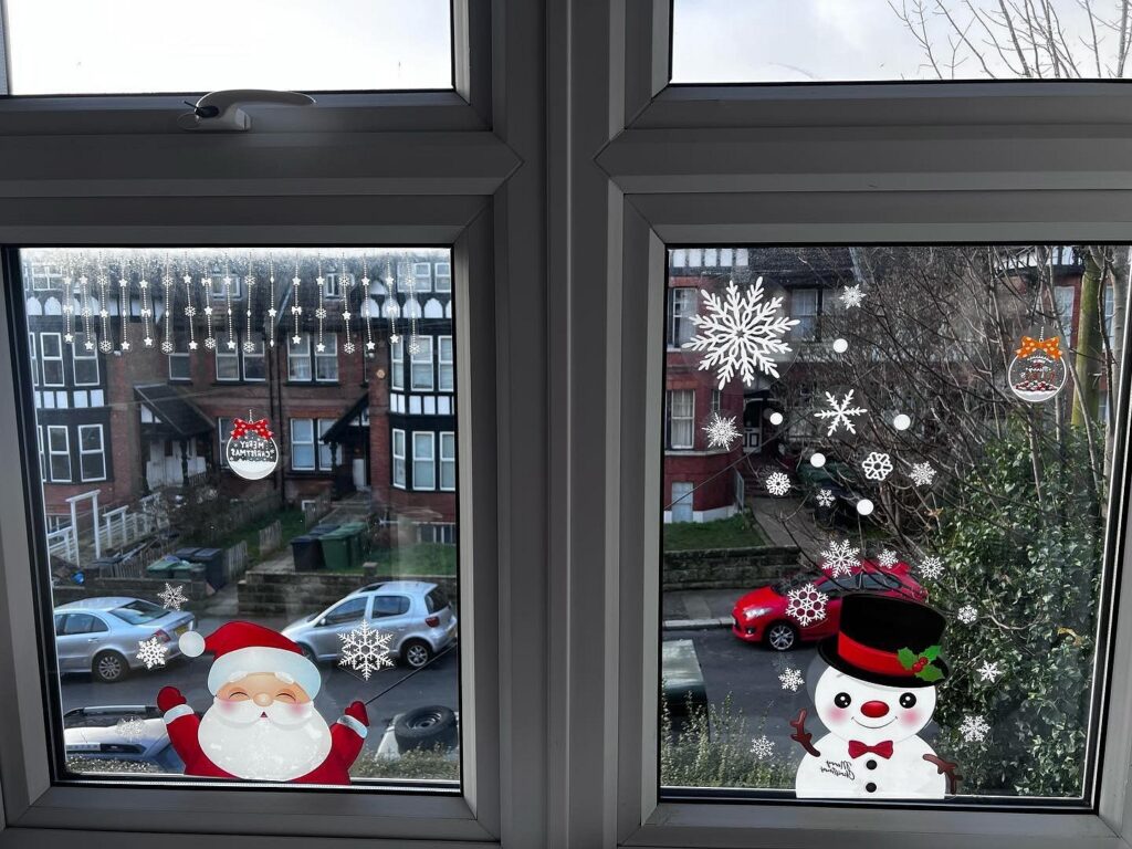 Santa claus and snowflakes on a window.