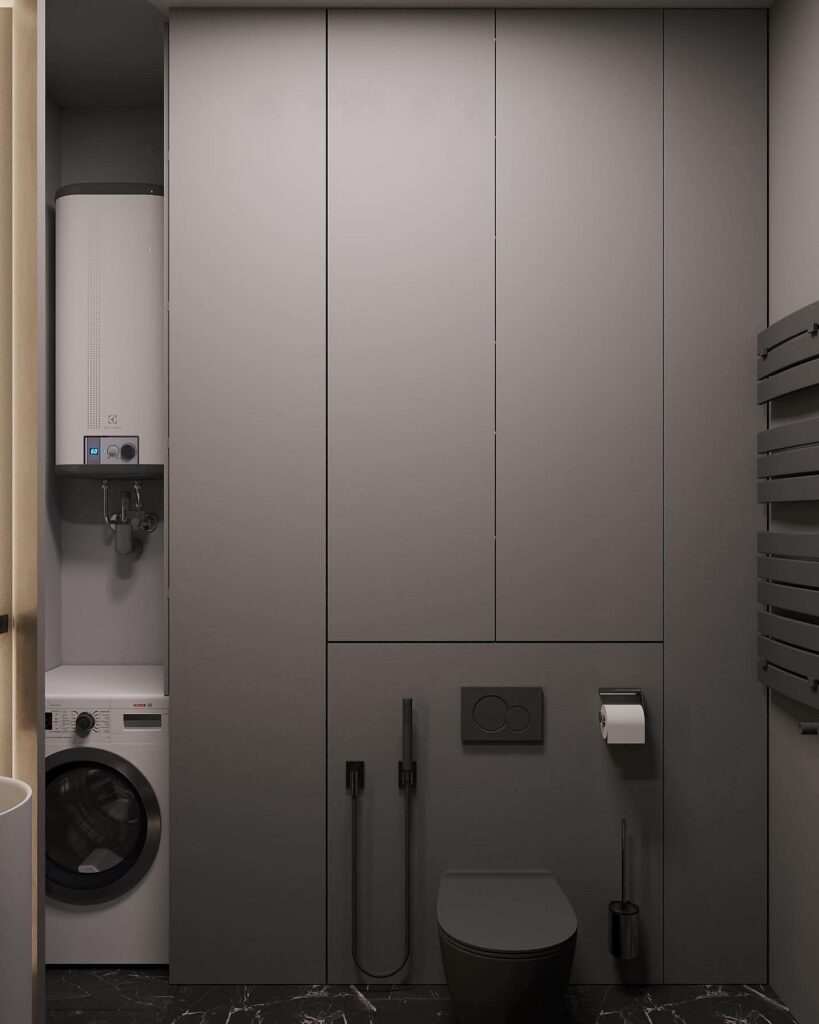 A modern bathroom with a washing machine and sink.