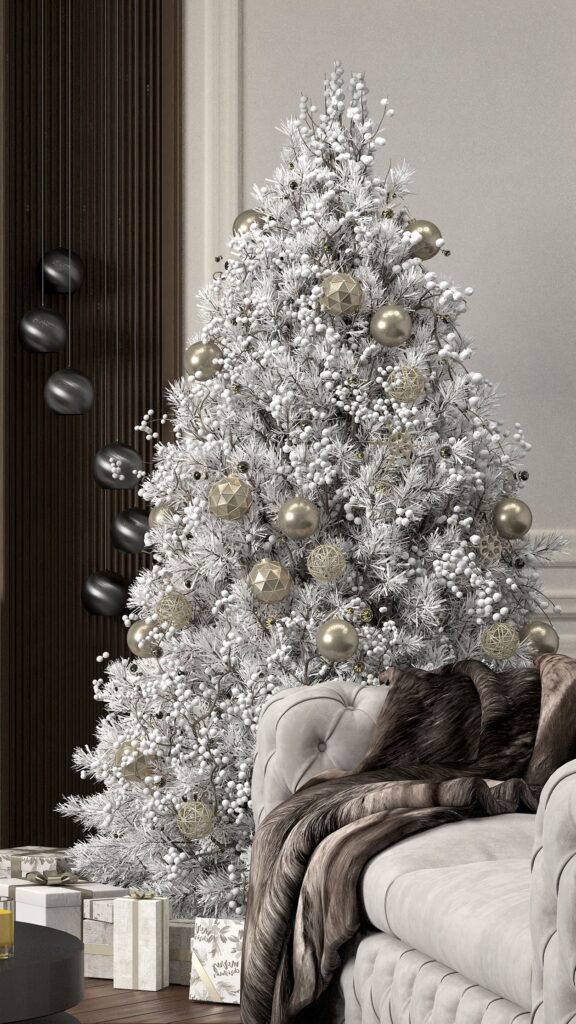 A white christmas tree in a living room.