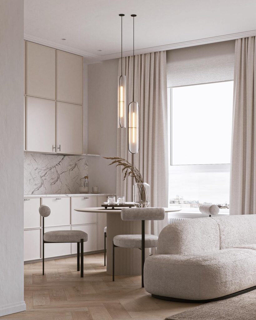 A living room with a white couch and a dining table.