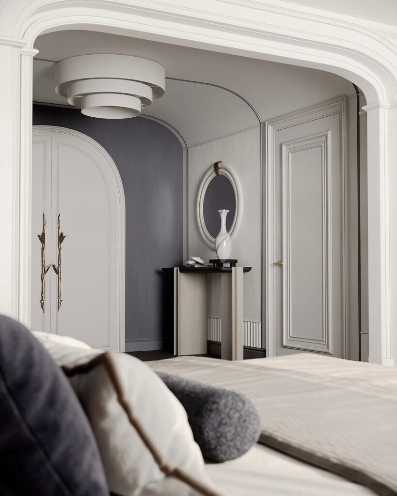 A bedroom with an arched door and a mirror.