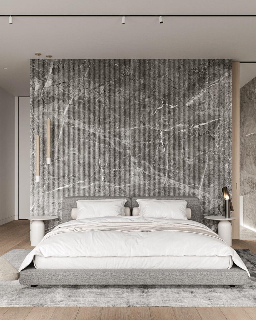 A modern bedroom with a marble wall.
