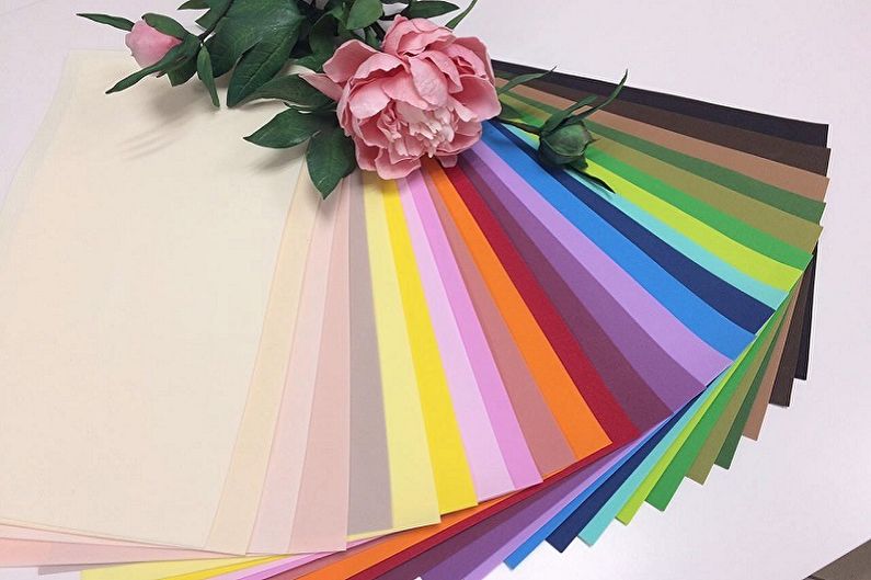 A sheet of colored paper with a flower on it.