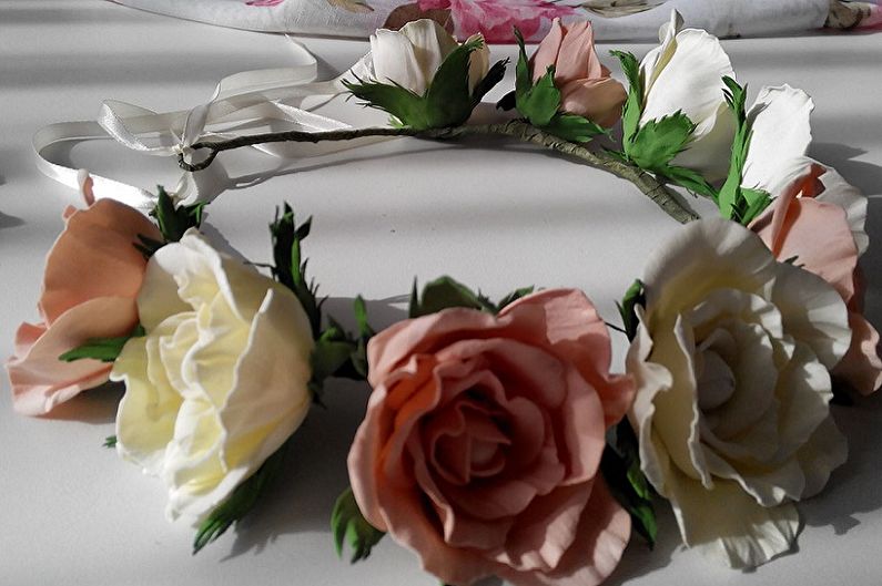 A white and pink flower crown on a table.