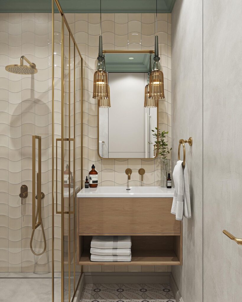 A bathroom with a gold and beige color scheme.