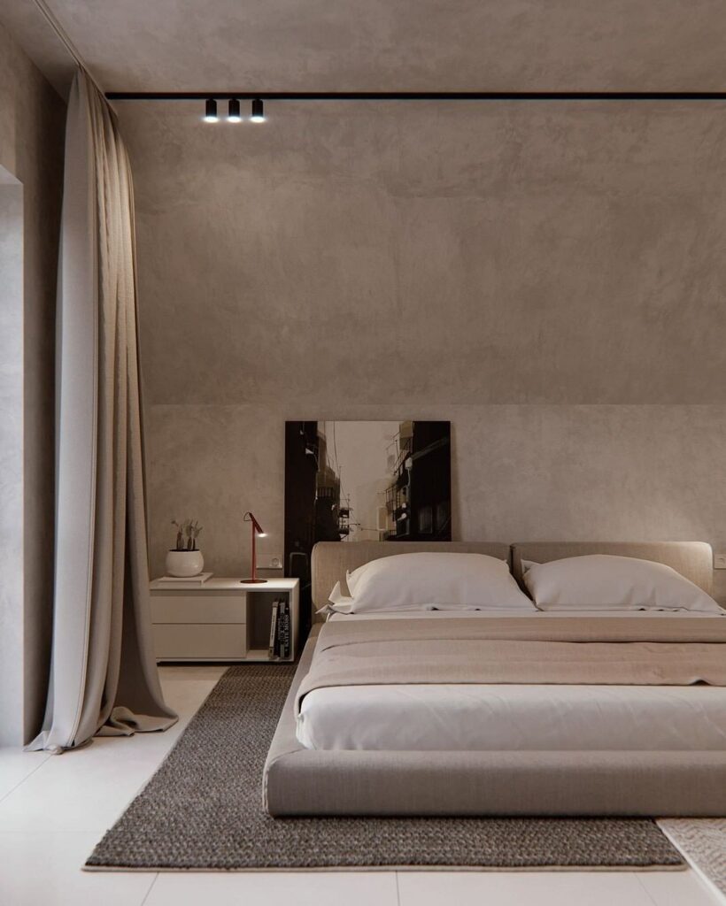 A modern bedroom with a white bed and grey walls.