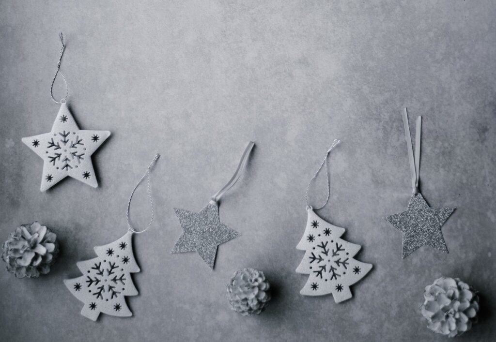 A group of christmas decorations on a concrete wall.