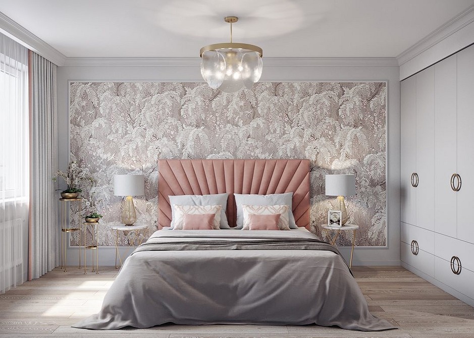 A bedroom with a pink headboard and wallpaper.