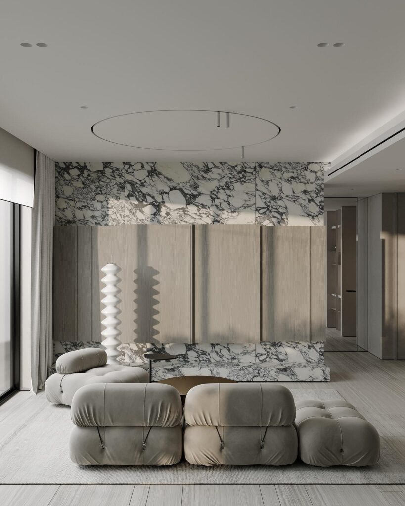 A modern living room with a marble wall.