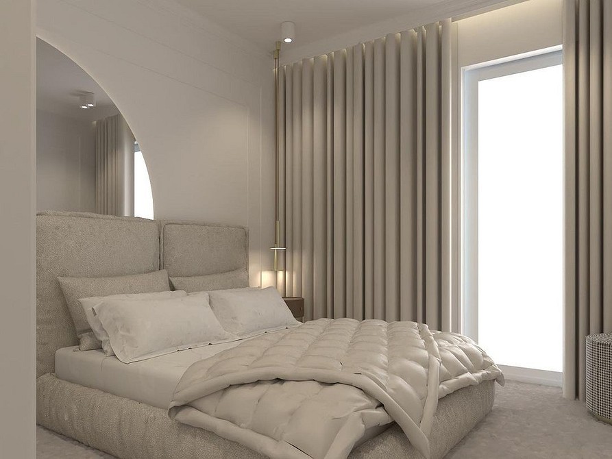 A bedroom with a white bed and a large mirror.