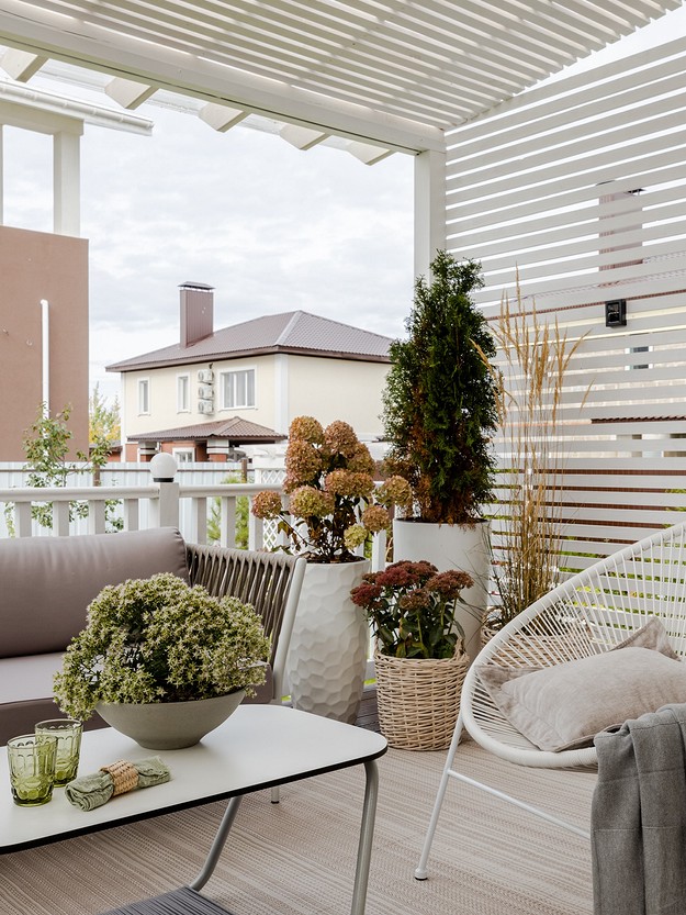 A patio with a table and chairs.