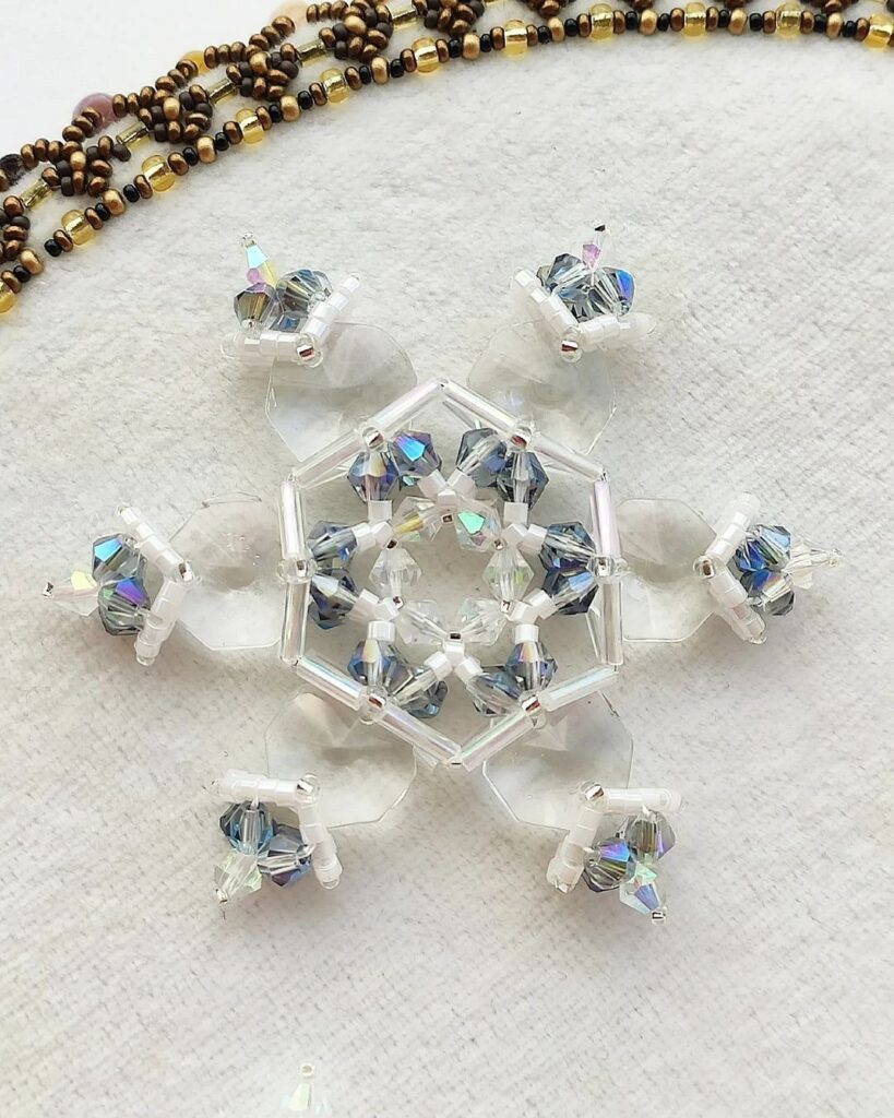 Swarovski crystal snowflake embroidery.