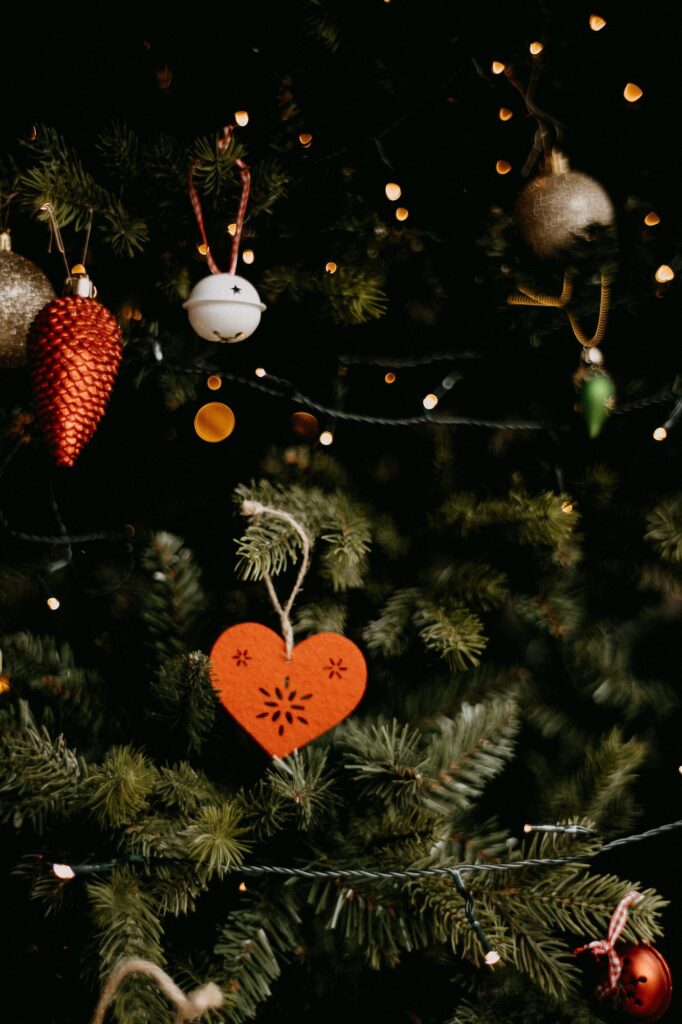 A christmas tree with ornaments hanging from it.