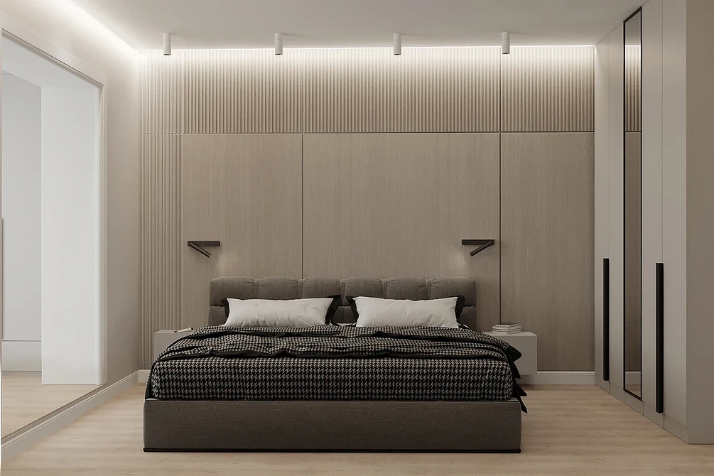 A modern bedroom with wooden walls and a bed.